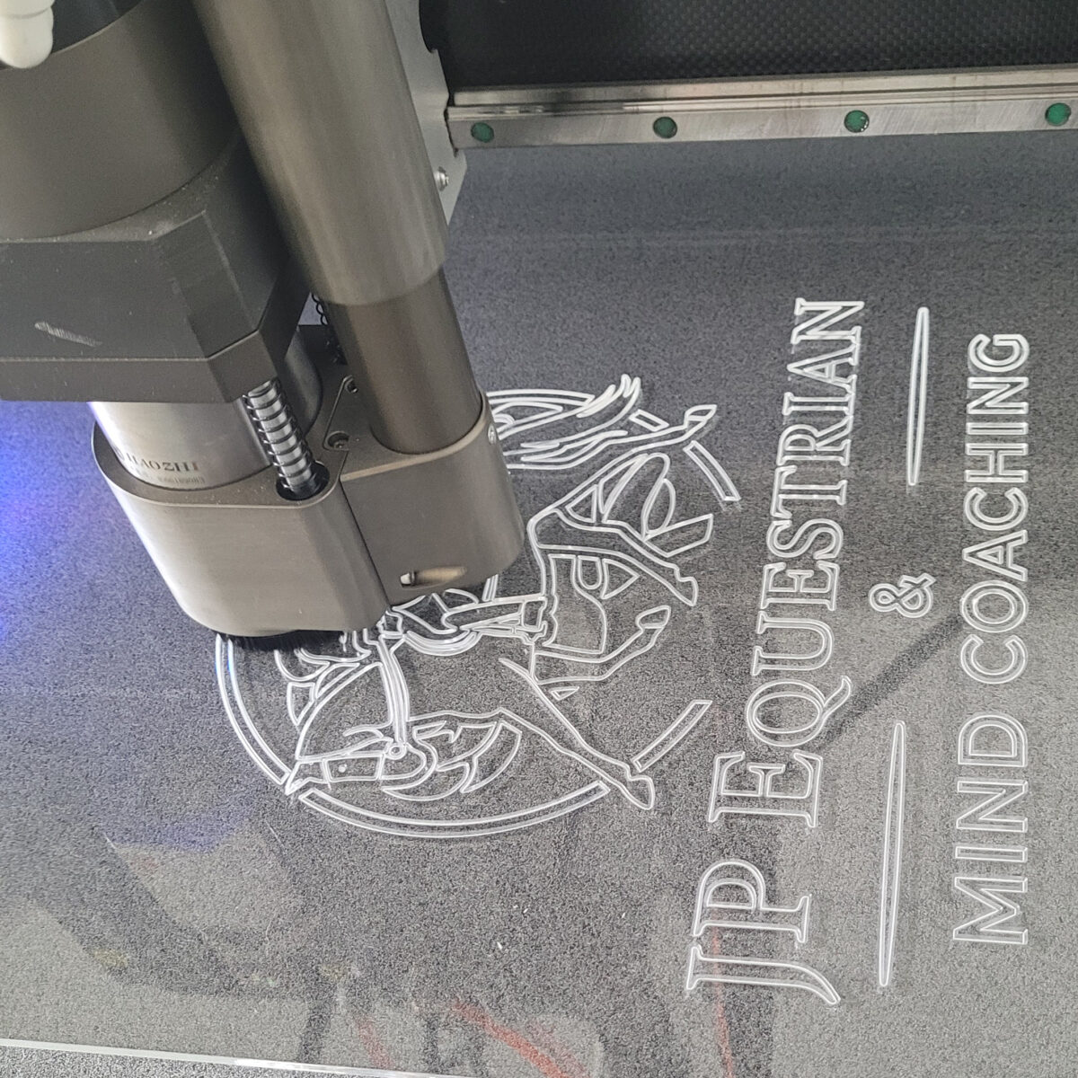 5mm Acrylic panel, shown being engraved with a company logo design
