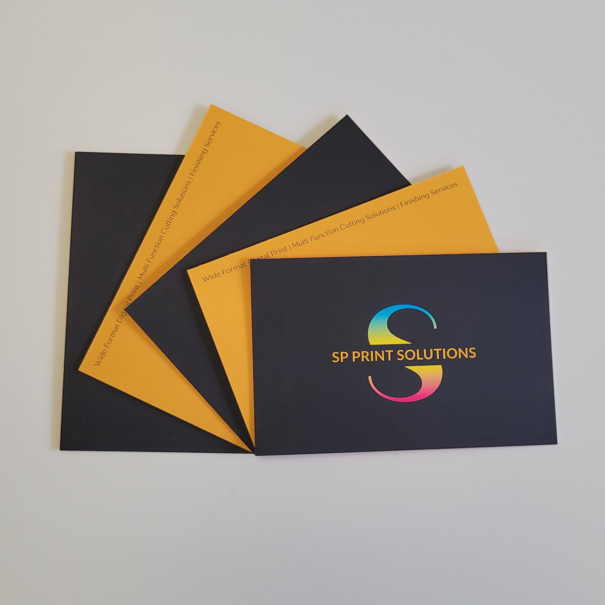 450gsm soft touch laminated silk business cards, with fronts and backs displayed in a fan shape