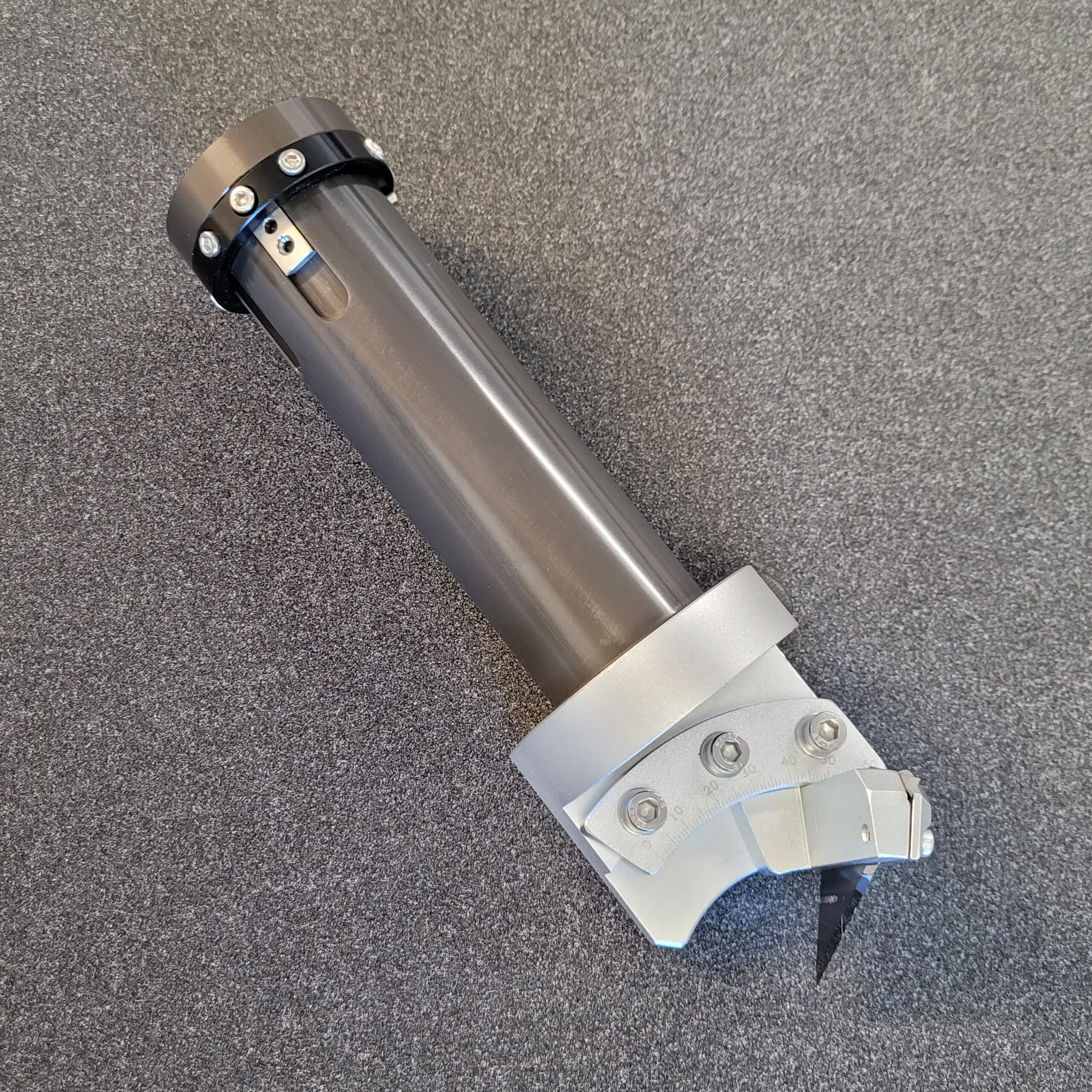 The V shape cutting tool, showing the variety of angle positions available